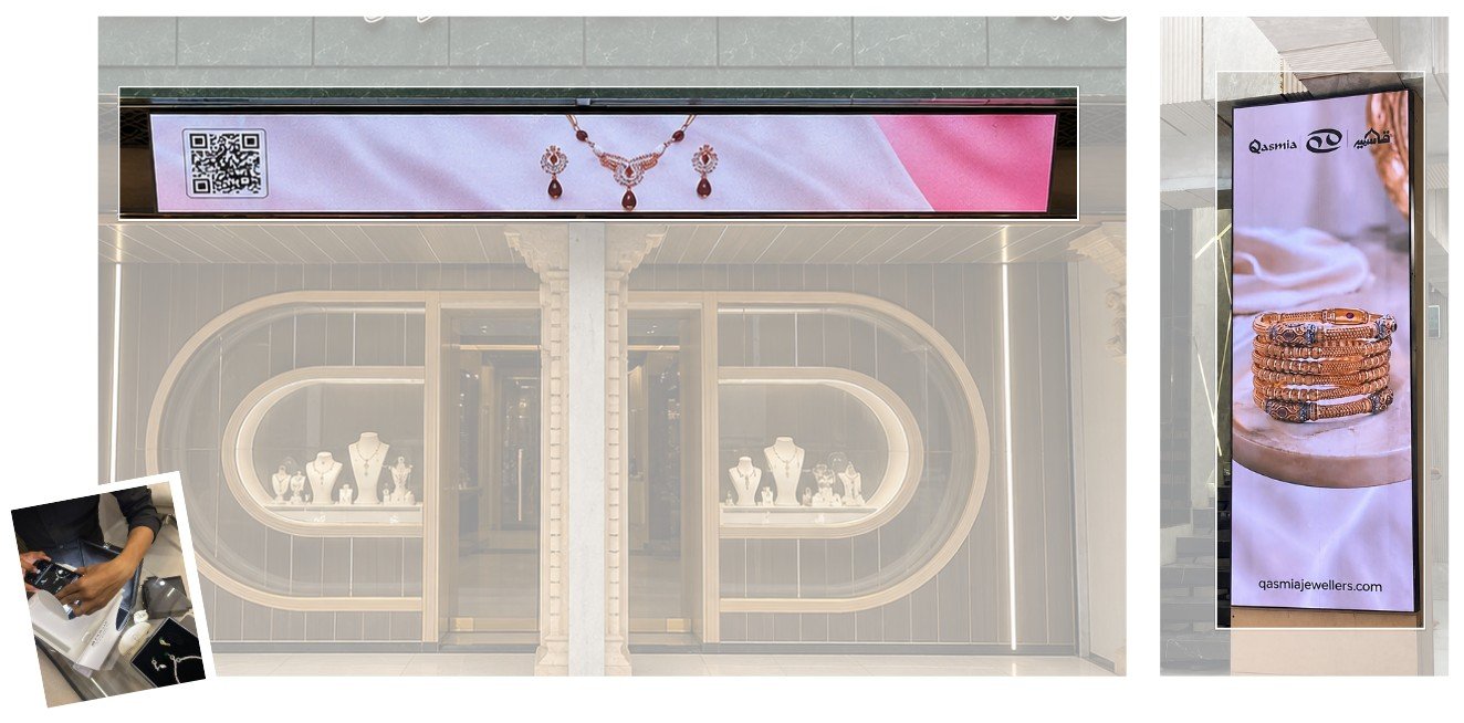 Qasmia showroom entrance with an SMD display above the door and a vertical indoor display